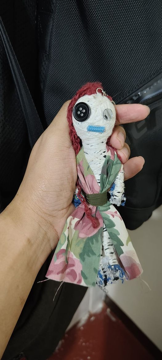 I'm not good at this stuff.I was gifted a small rag doll (that looks rather new) that I turned into a keychain and hung from my backpack by a mobile store owner at a tourist spot when I went on vacation (bought a lot from the old guy and I was just assuming it was a freebie). I did not think anything of it and nothing weird happened. Last week I attended a funeral for my friend's cousin and the priest pulled me aside and told me to hand over the ragdoll and he was very serious and demanding. I did not hand it over as it seemed very weird to me and he relented, but was adamant that if I change my mind, to contact him. Again the ragdoll has been with me for a few months now, nothing weird happened at all. Should I be concerned?